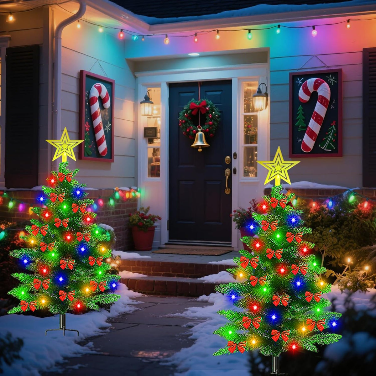 Solar Christmas trees by a snowy entryway