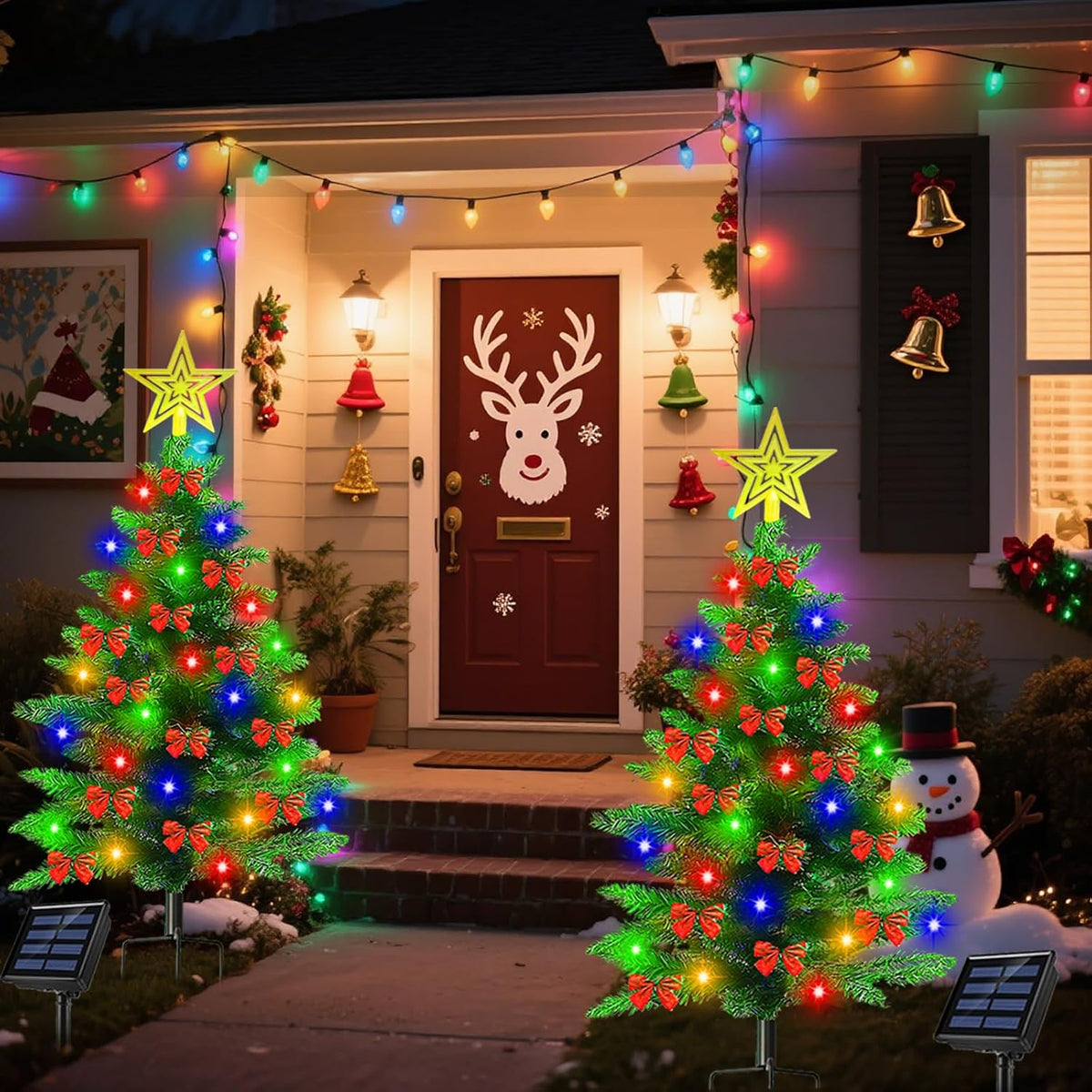 Pre-lit solar Christmas trees beside a decorated front door